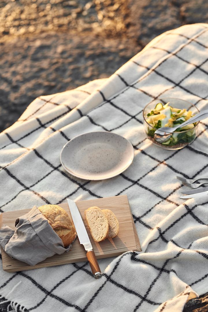 The essential summer picnic blanket from Klippan Yllefabrik seen here, perfect for a picnic on the beach, 