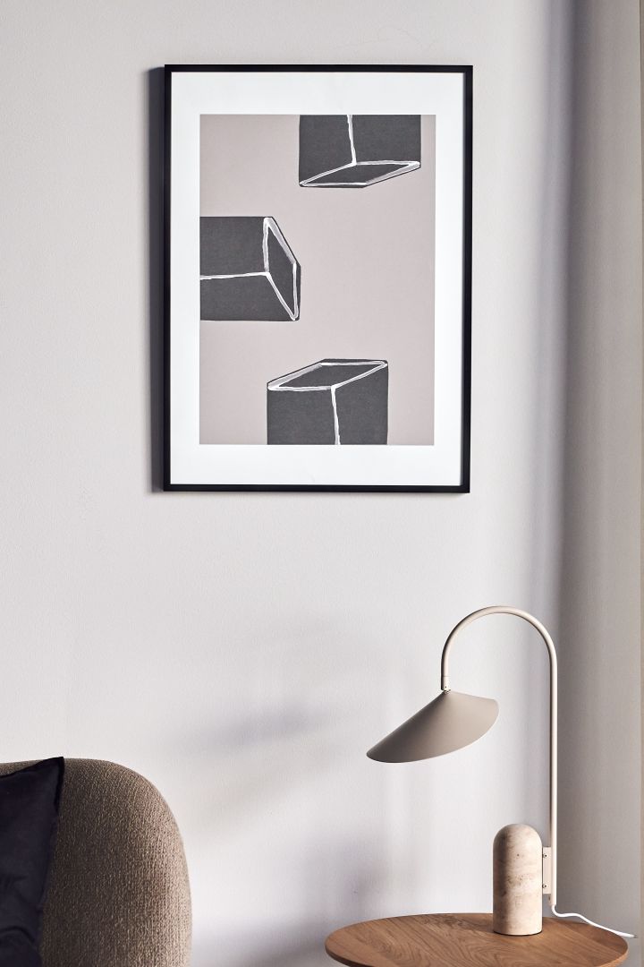 17 stylish Scandinavian wall posters to give your walls an update - here you see the abstract Dimensions poster from Scandi Living in tones of grey and white that represent graphic cubes.
