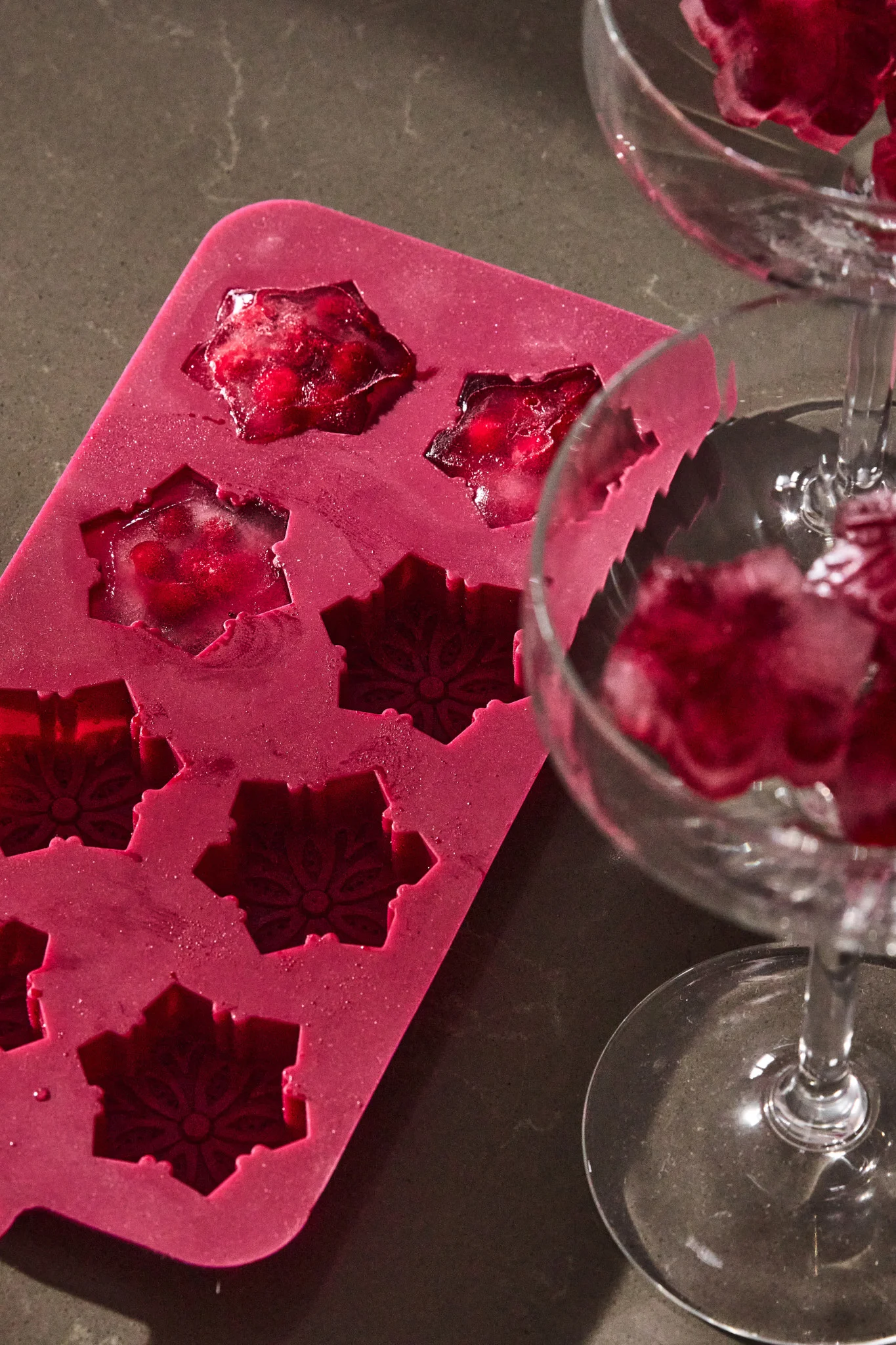 A fresh New Year’s drink where fresh berries are frozen in a silicone mold and turned into decorative ice cubes that chill the drink.