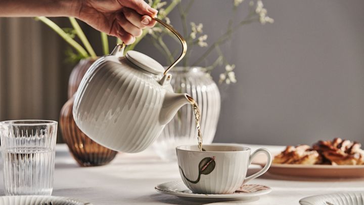 Enjoy a cup of tea and a cinnamon bun from the Hammershøi teapot and poppy tea cup and saucer.