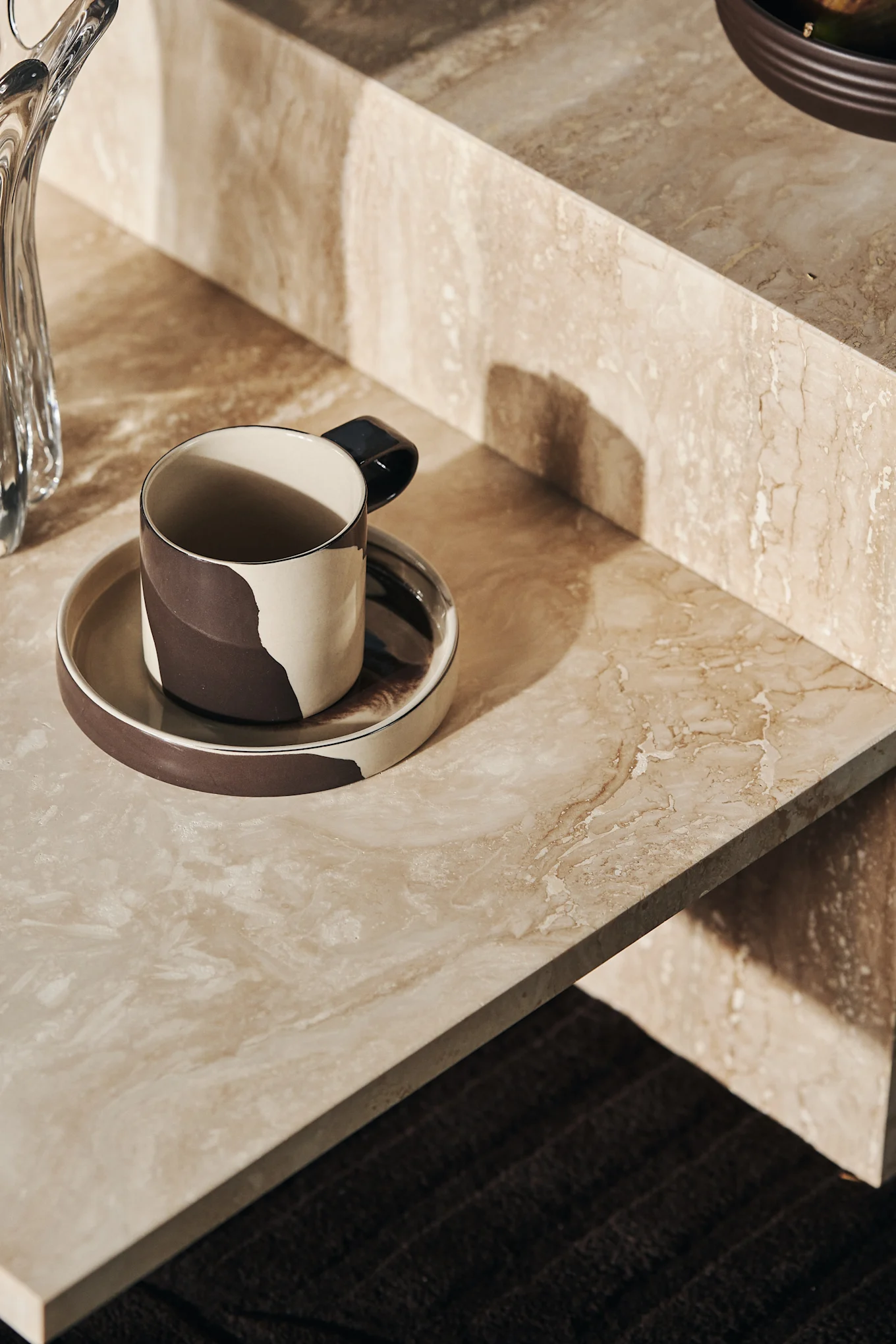 Inlay cup with saucer on Disctinct side table from Ferm Living.