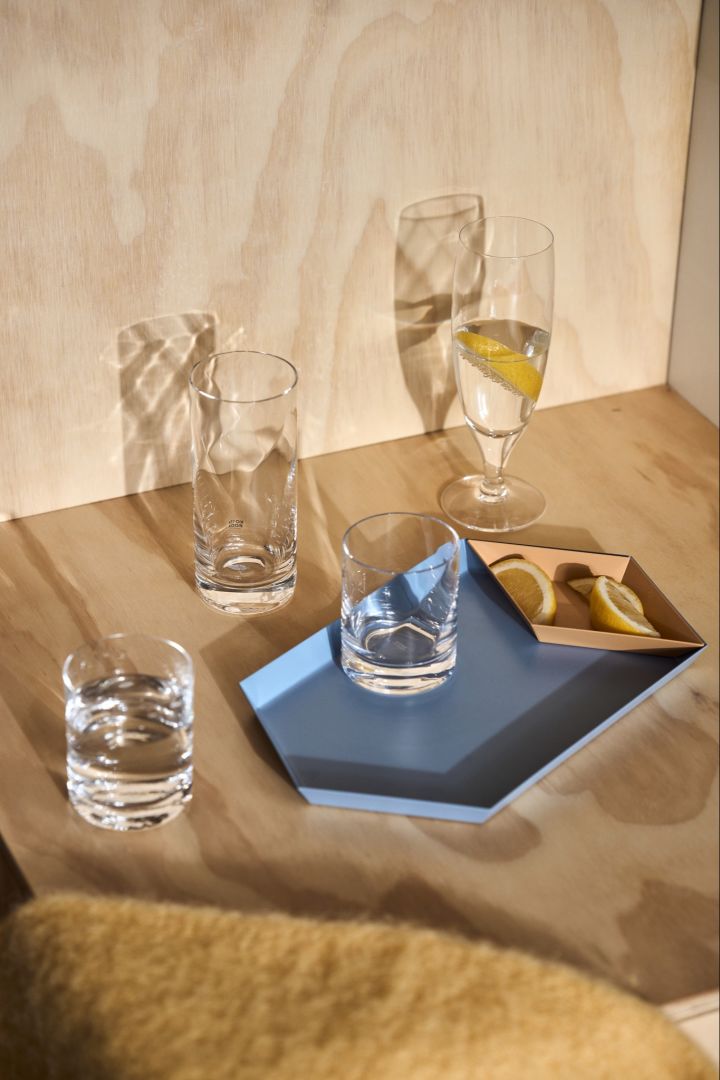 A collection of clear drinking glasses from the chateau collection catching the afternoon light.