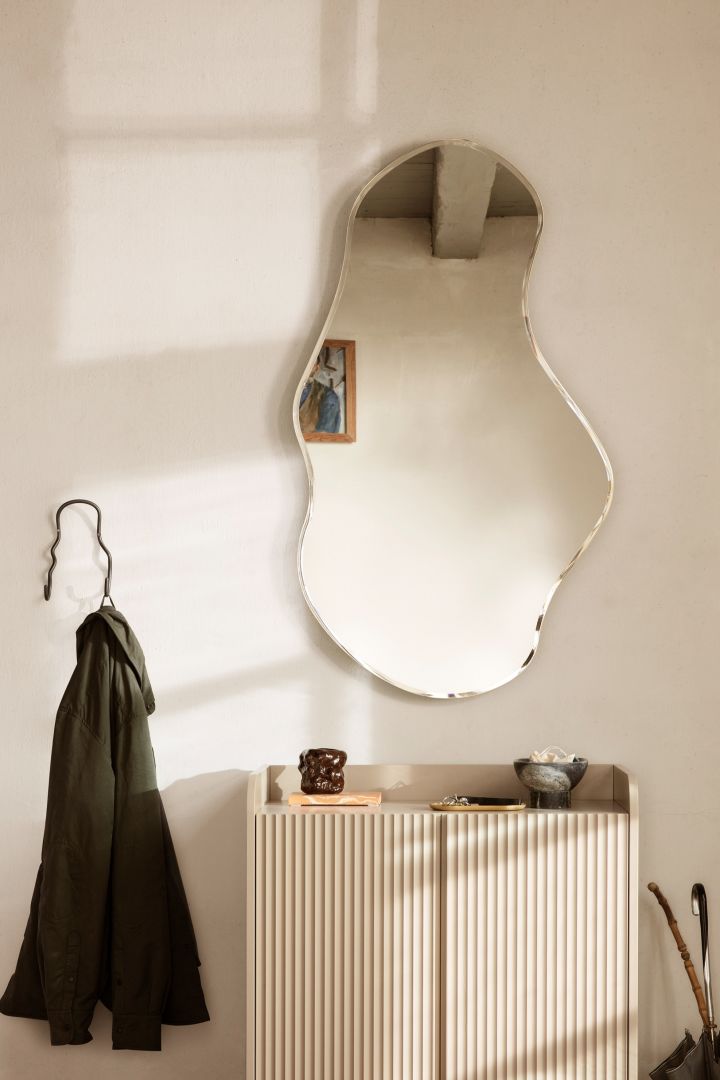 Pond mirror from Ferm Living shows how undulating shapes on mirrors will be trendy in our interior in 2022.