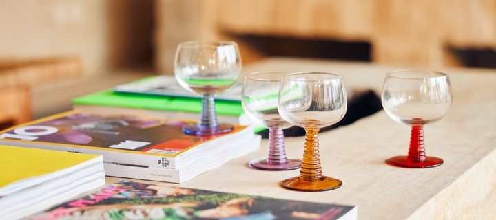 Scandinavian interior design trends in 2023 take a nostalgic turn with these 70s-inspired glasses with coloured stems from HK Living.