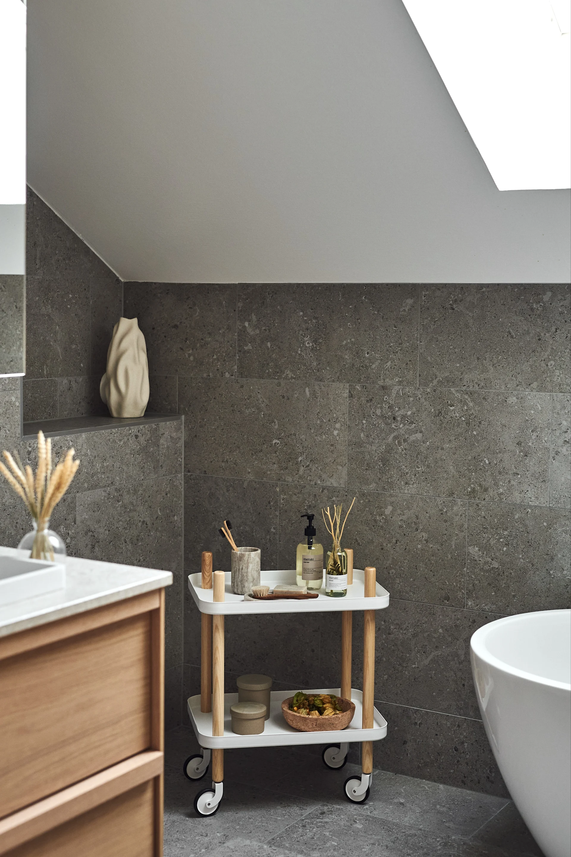 Spa ecor ideas for your bathroom like this rolling trolley from Normann Copenhagen so you can easily access everything you need for a relaxing spa moment. 