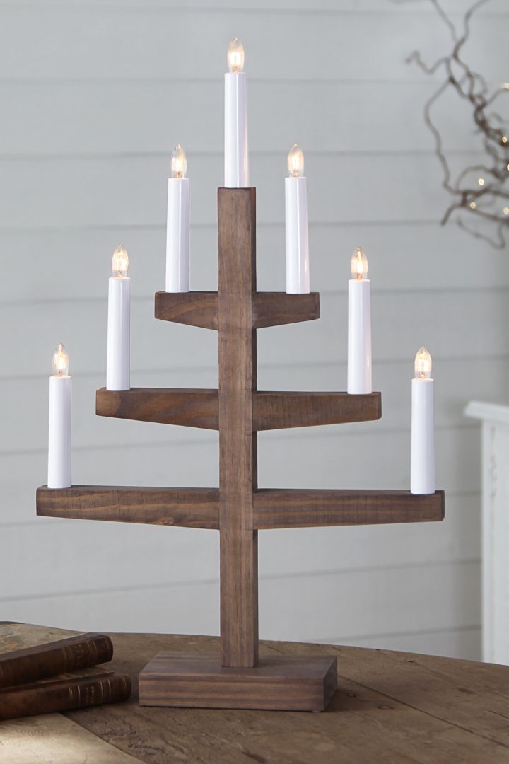 How to decorate with traditional Scandinavian Christmas decorations - The elegant Trapp candle arch from Star Trading in stained wood adds a traditional Scandinavian feeling to your home at Christmas time. 