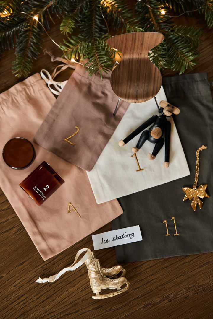 Use the Christmas countdown Christmas calendar from ferm LIVING and fill your own advent calendar with the Kay Bojesen monkey, Christmas pendant, mini chair, skates or scented candles.