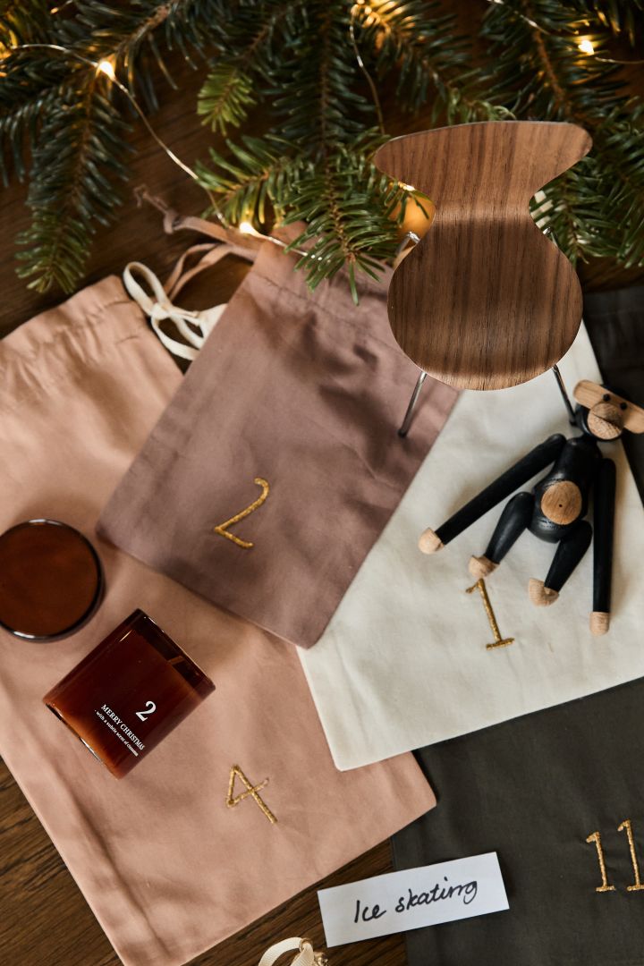 Use the Christmas countdown Christmas calendar from ferm LIVING and fill your own advent calendar with the Kay Bojesen monkey, Christmas pendant, mini chair, skates or scented candles.