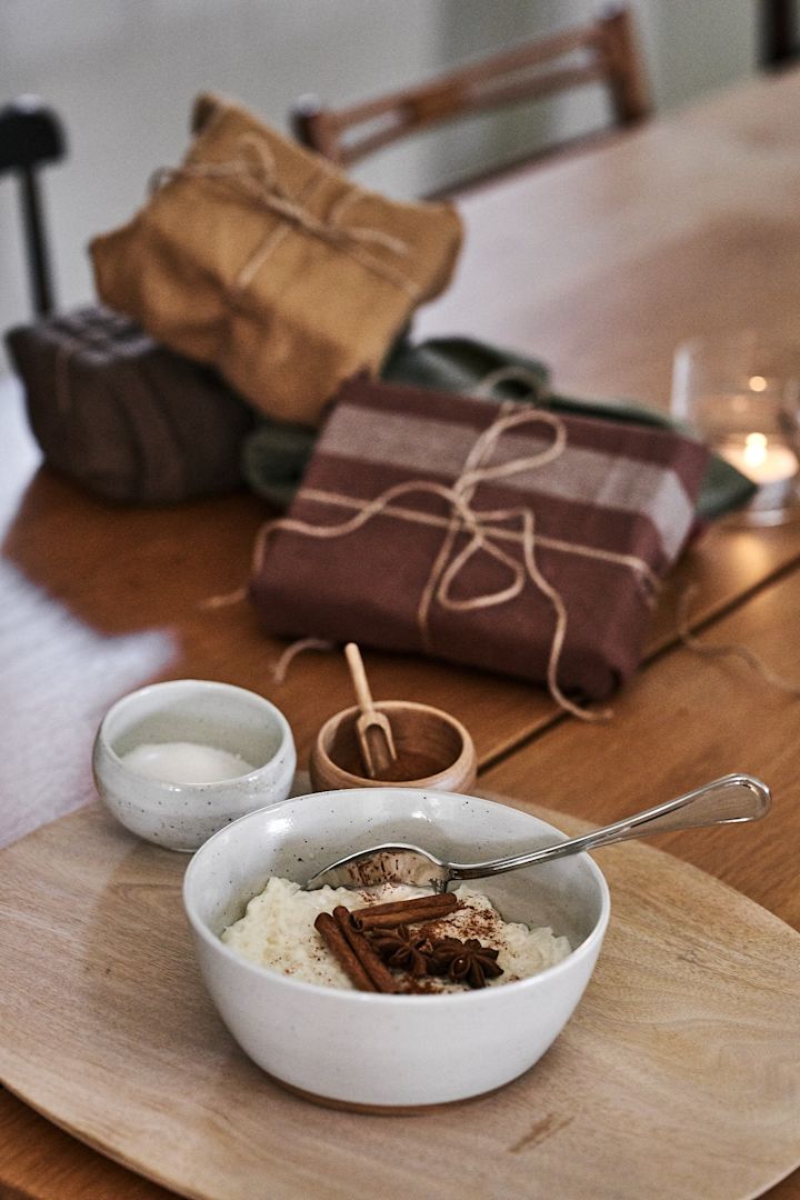 The Christmas rice pudding is on the table, and the Christmas gifts are wrapped in tea towels for more sustainable gift wrapping.