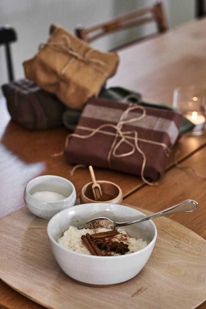 The Christmas rice pudding is on the table, and the Christmas gifts are wrapped in tea towels for more sustainable gift wrapping.
