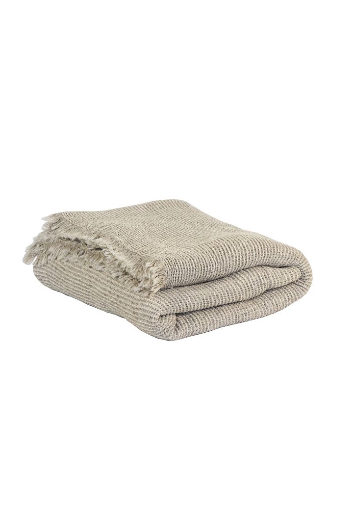 Beige knitted blanket from Tell Me More for a cosy dining area. 
