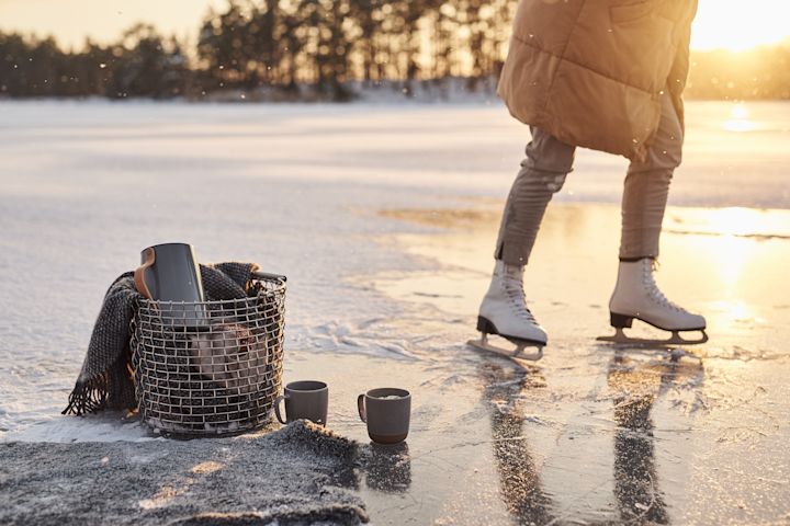 Scandinavian lifestyle things for you to try this winter - Ice skating on a lake with a thermos from Stelton filled with hot coffee. 