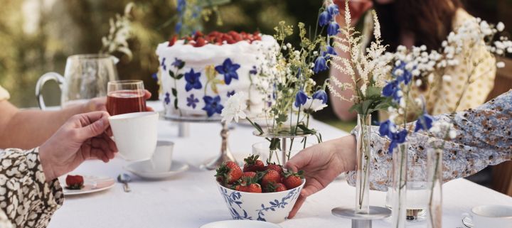 Enjoy a real Swedish midsummer celebration, blue and white table decorations are traditional like the havspil bowl from Scandi Living filled with strawberries.