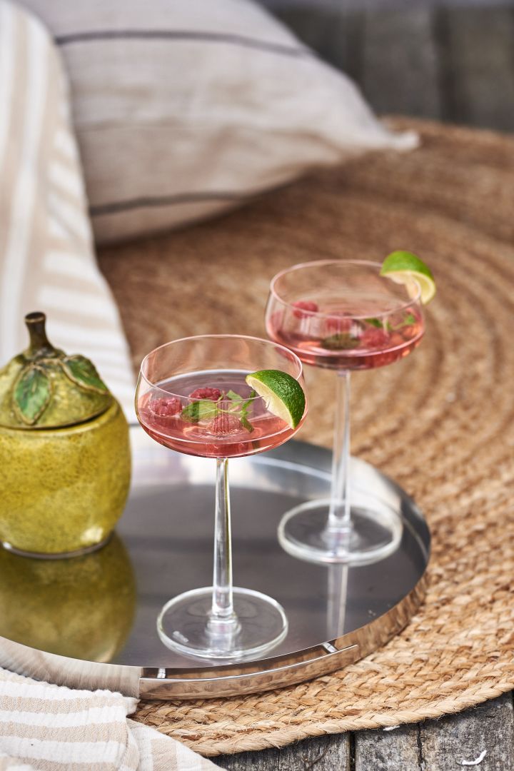 For a simple and refreshing summer drink try gin with rasberry juice, garnished with lemon balm and fresh rasberries served in Essence cocktail glass from Iittala.
