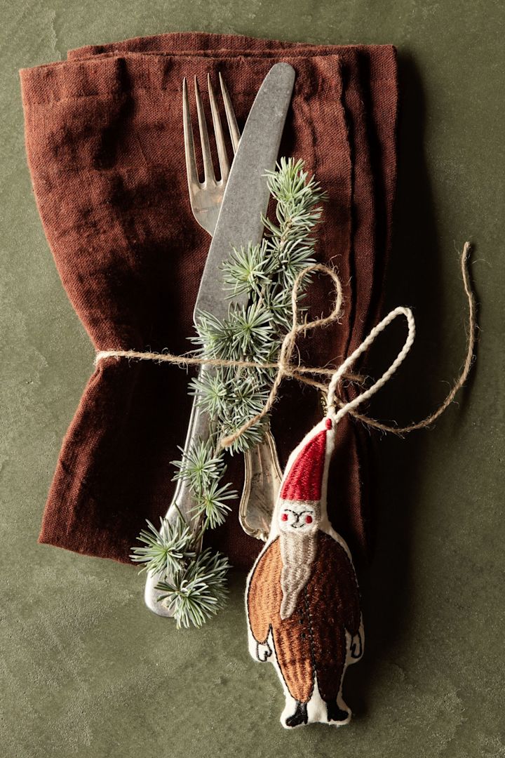 Textile Christmas pendants, here a cute Santa from Ferm Living is a popular feature among this year's Christmas decor trends 2022.