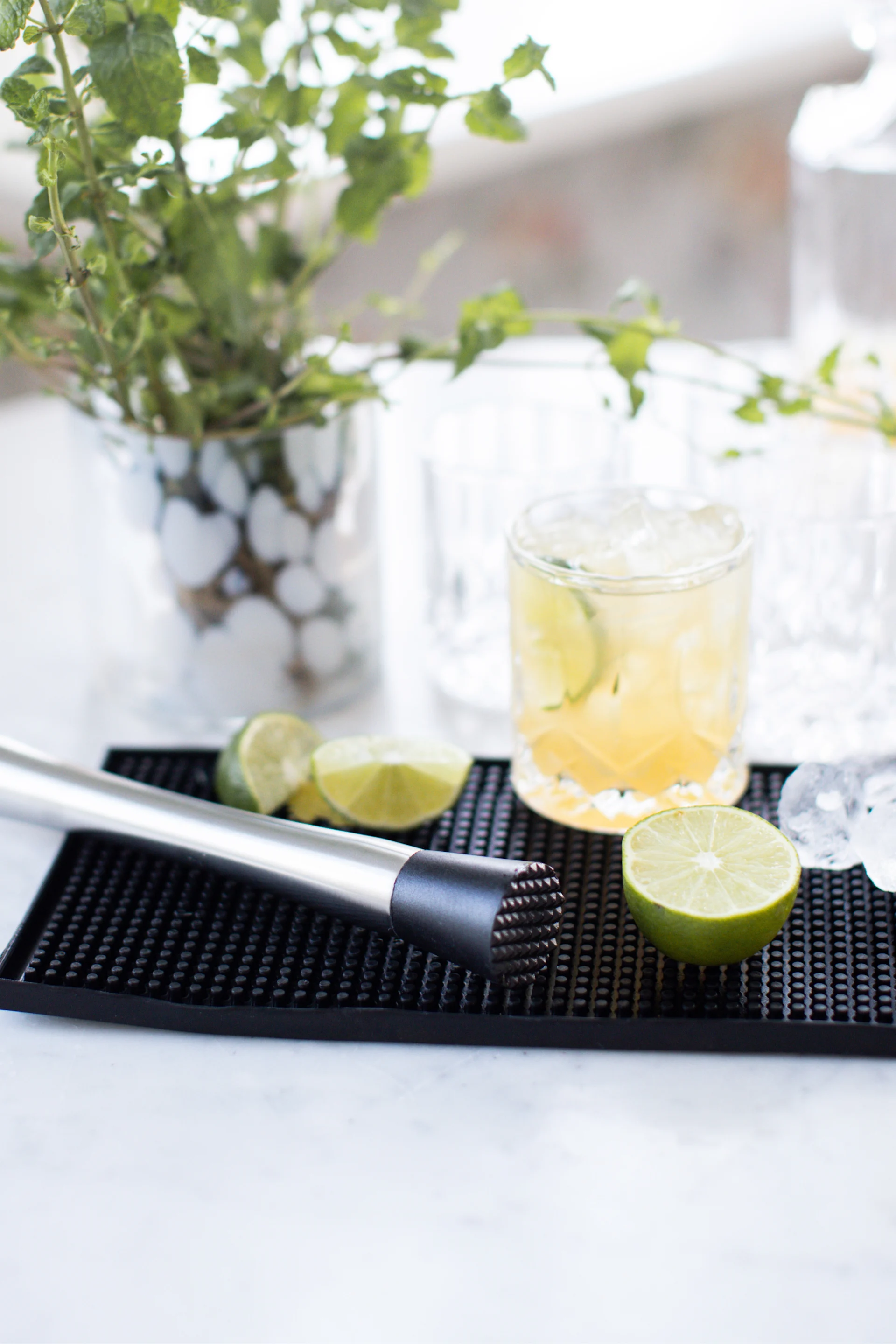 Mocktails: A virgin caipirinha with lime and brown sugar stands on a bar mat.