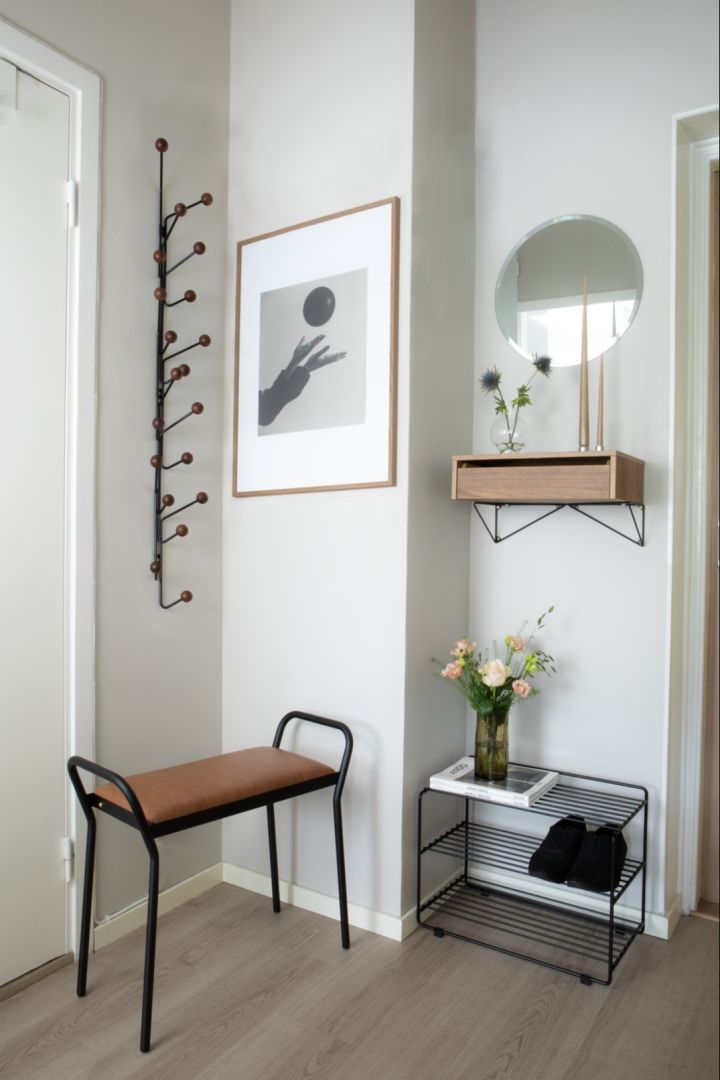 The Bill vertical coat hanger, Downtown shoe rack and Around stool from Maze in a small hallway. 