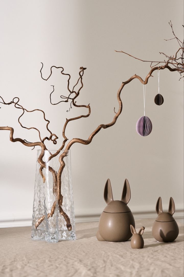 How to make an Easter tree - here you see the Hein Studio vase with a collection of DBKD rabbits in chocolate brown with the paper eggs also from DBKD. 