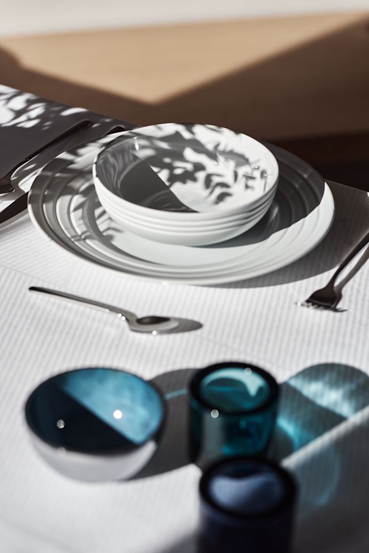 A white table setting with the Lines bowl and plate from NJRD. 