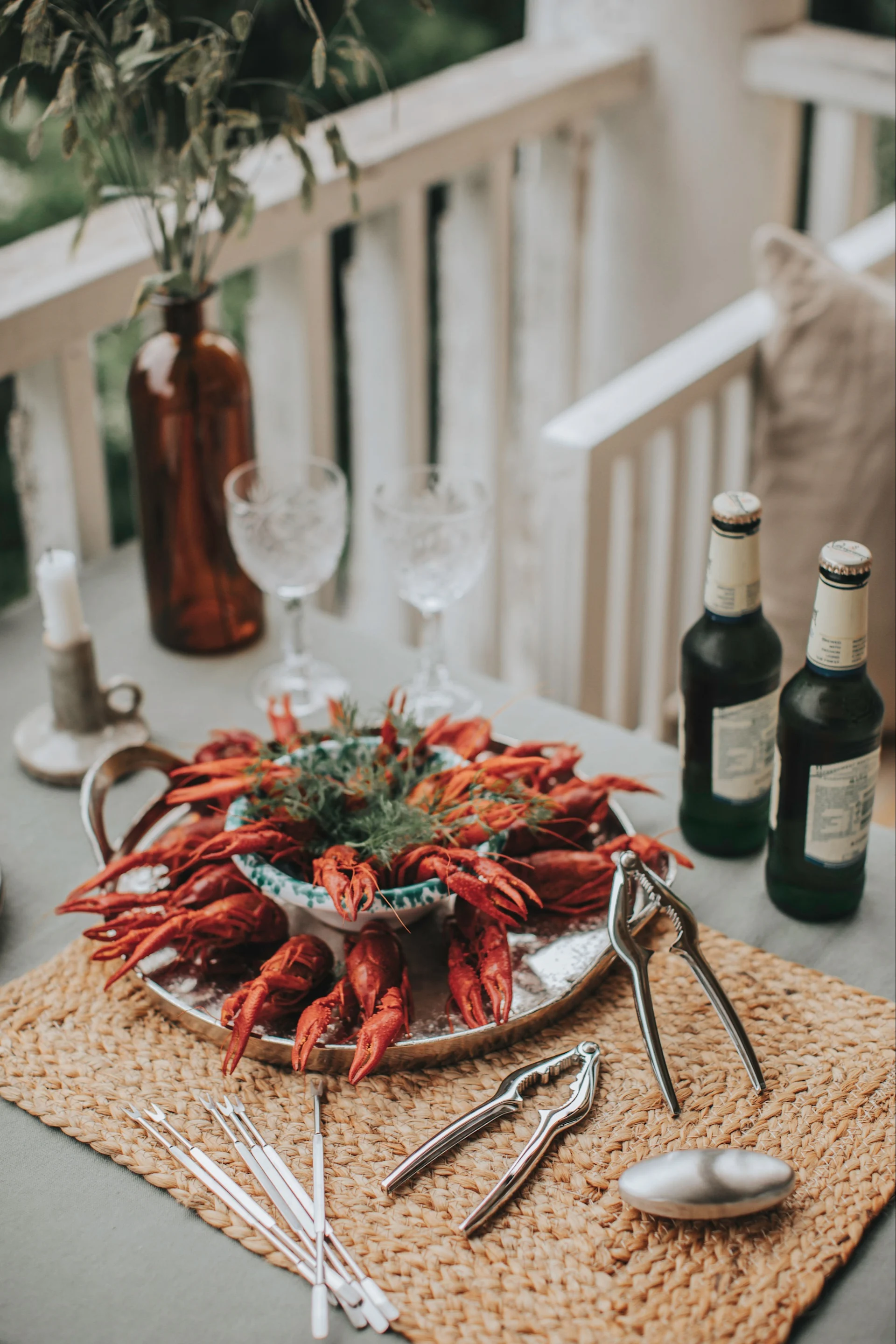 A table set with crayfish and the seafood set from Dorre, ready to host a Swedish crayfish party.