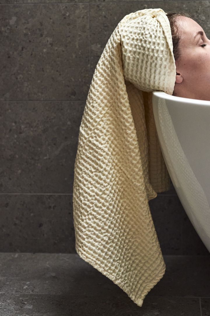 Spa decor ideas for your bathroom that include luxurious towels like this waffle patterned towel from Ferm Living.