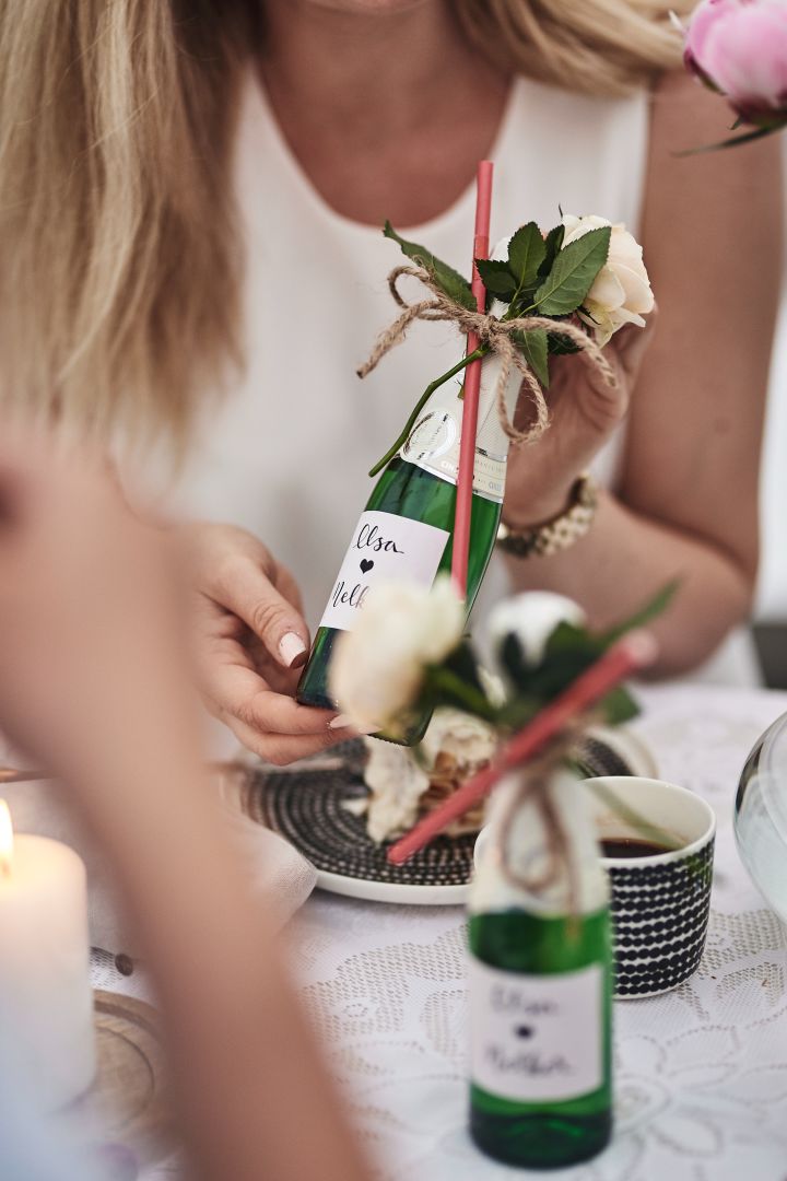 A homemade label on a champagne bottle is a nice craft idea for Valentine's Day and looks adorable on a romantic table setting 