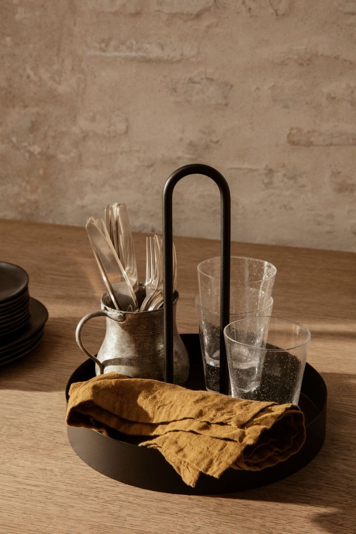 Renew your kitchen with 11 practical and stylish kitchen accessories for easier cooking - here you see stylish and practical Ferm Living Grip Tray in black.