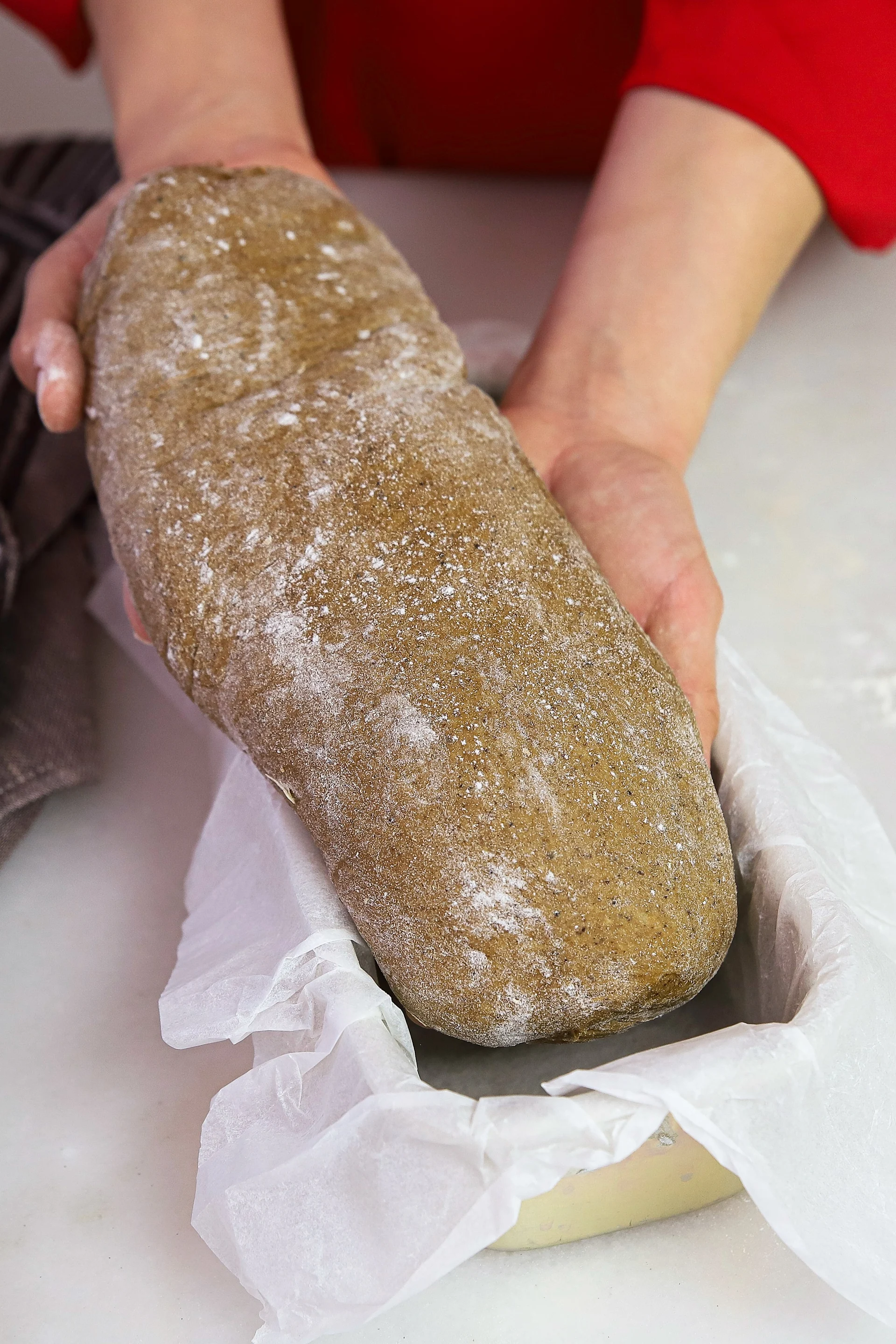 Christmas baking recipes from Baka med Frida - Frida places her Swedish wort bread in a narrow bread tin lined with baking paper.