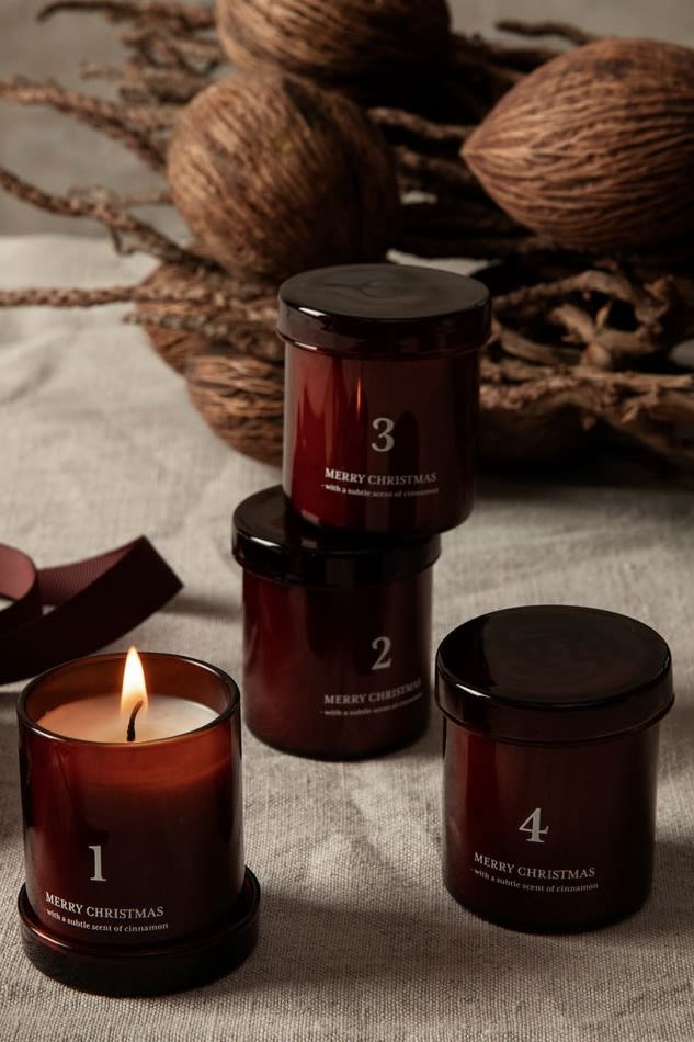 How to decorate with traditional Scandinavian Christmas decorations - Scented advent candles like this cinnamon set from Ferm Living in festive red, add an extra layer to the christmas atmosphere at home. 