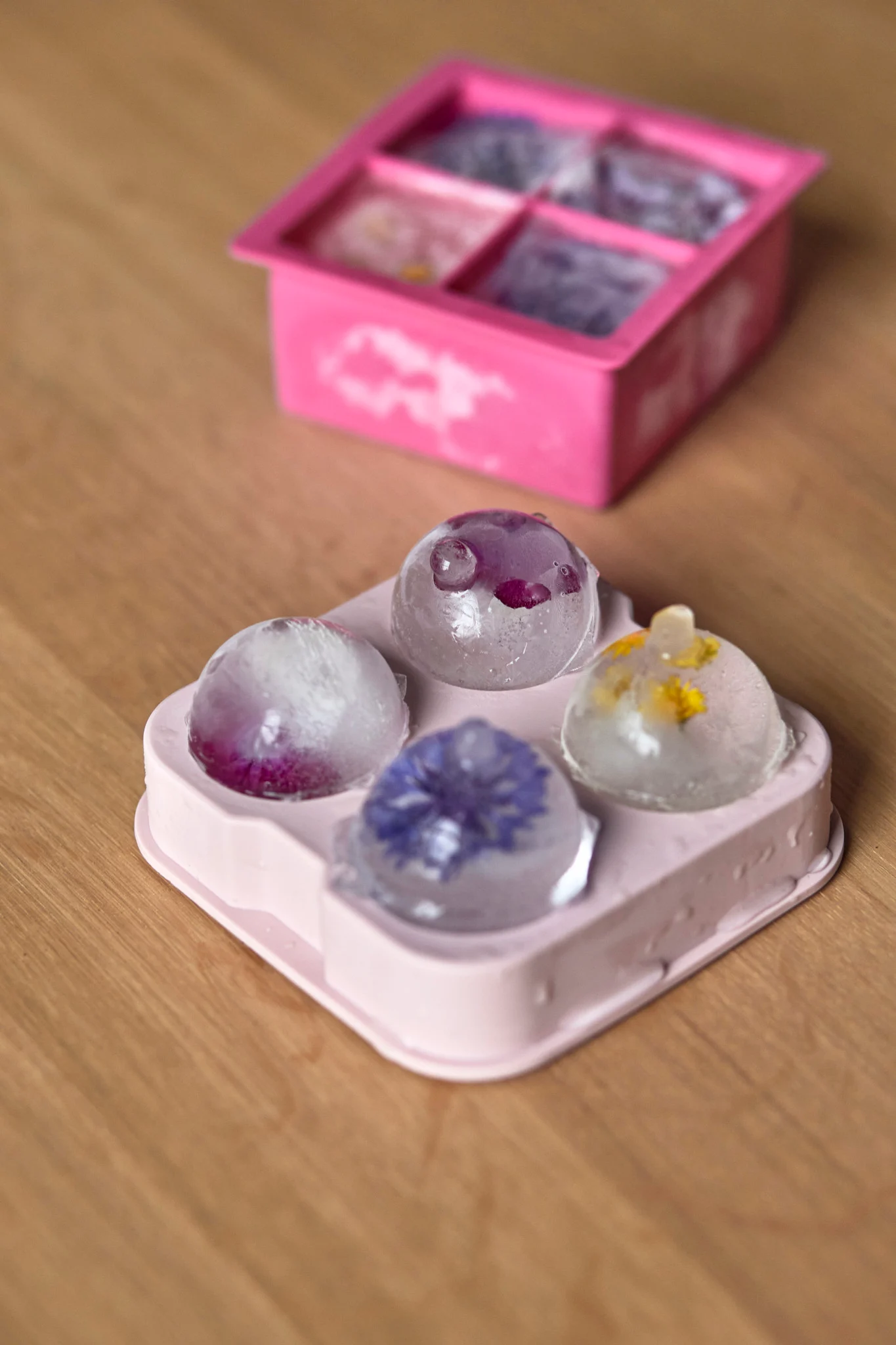 Freeze flowers or fruit in ice cube moulds and use them to decorate your mocktail.