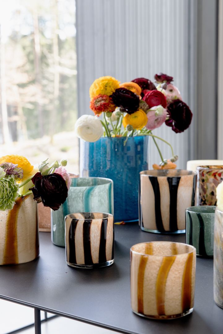 Colourful interior design from details to furniture is one of the interior design trends for spring 2022 - here you see Calore candle lanterns in spring shades from By On.