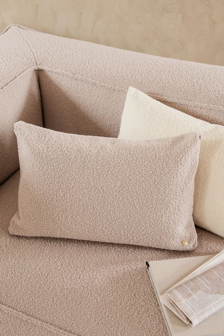 The teddy material is one of the interior design trends for spring 2022. We see it here on the Clean bouclé pillow from Ferm Living.