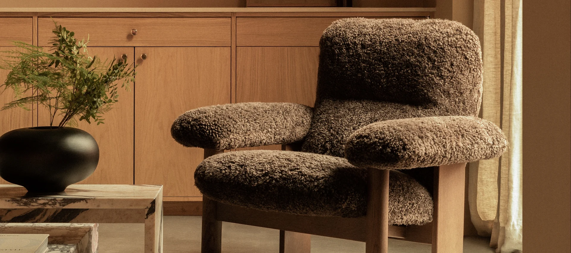Scandinavian Interior design trends 2025 - bulky shapes and tactility. Here Brasilia armchair from Audo Copenhagen.