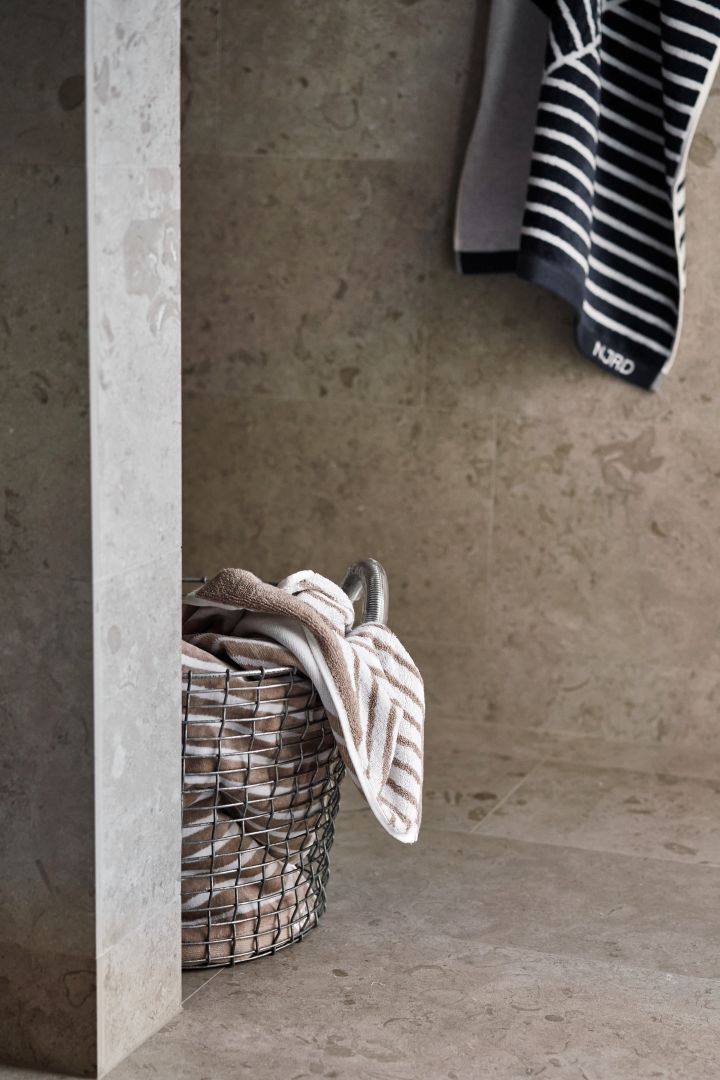 Storage solutions for small bathrooms - here you see the Korbo basket with a pile of NJRD bath towels. 