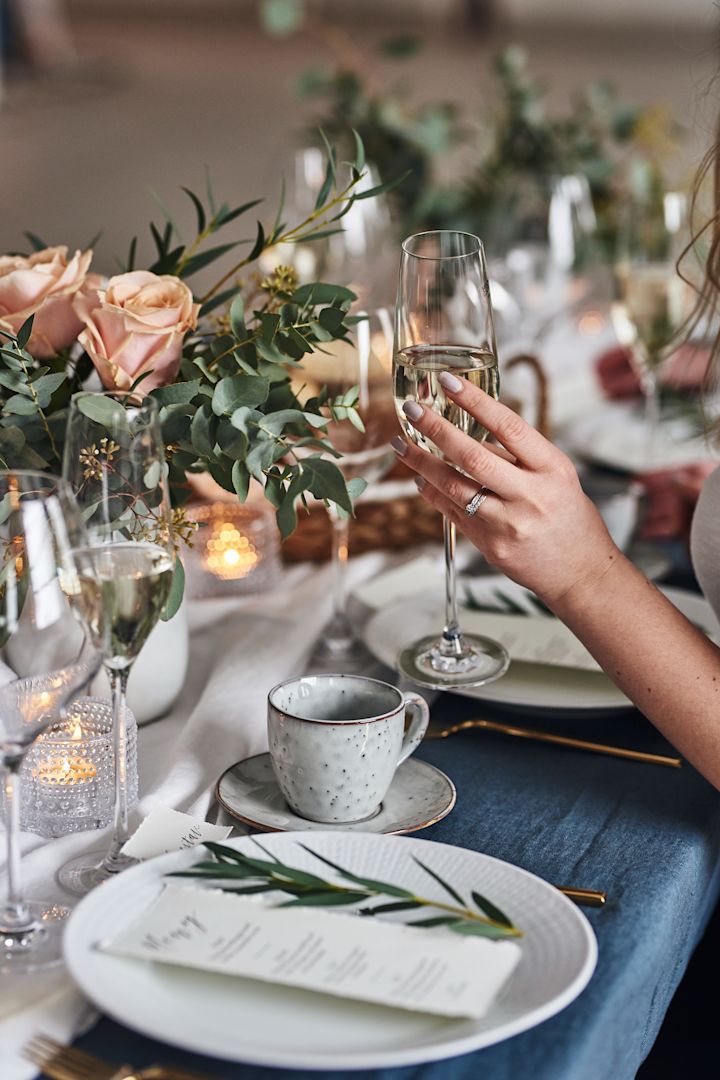 The bride toasts with Cabernet champagne glasses from Holmegaard - an elegant wedding gift idea.