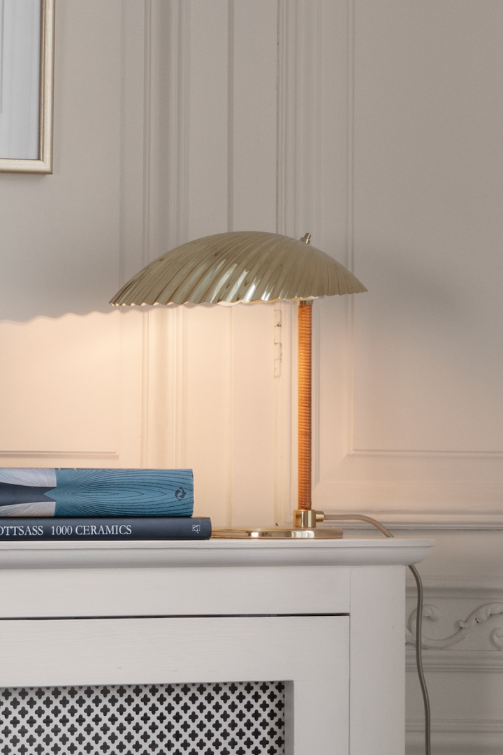 Discover Gubi's top tips for lighting your home. Here you see the 5321 table lamp with it's art deco shell shade. 