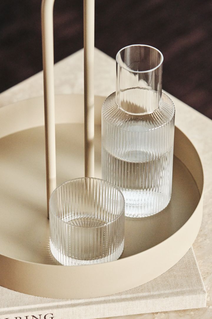 Ripple glass and carafe on Grib Tray from Ferm Living.