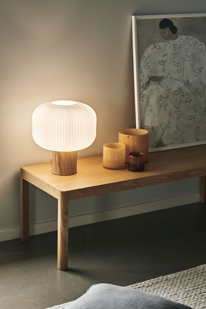 Create a cosy hygge living room with soft table lamps like the Fair table lamp from Scandi Living. 