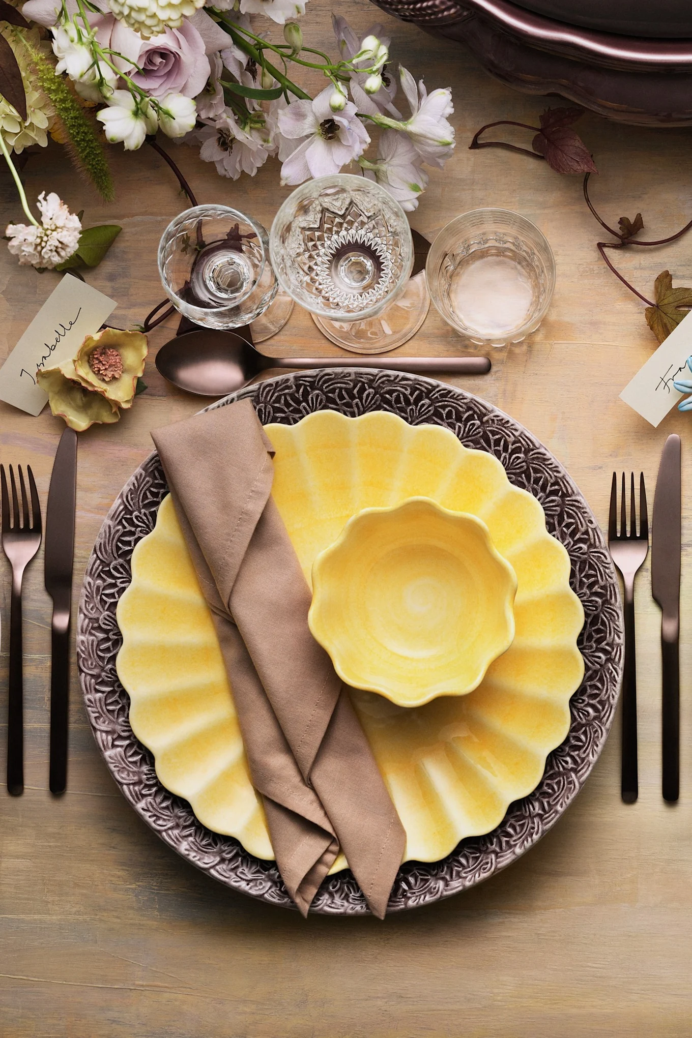 A table setting with yellow crockery from the Oyster collection by Mateus.