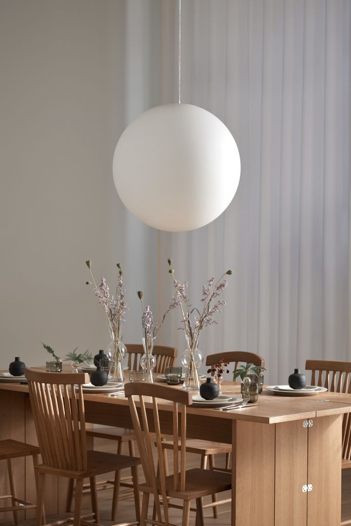 The Luna lamp from Design House Stockholm hanging over the dining table.