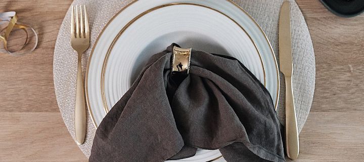 Napkin folding ideas - Clean linen napkin in charcoal from Scandi Living together with Bloomingville napkin ring with pearls.