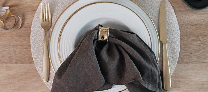 Napkin folding ideas - Clean linen napkin in charcoal from Scandi Living together with Bloomingville napkin ring with pearls.