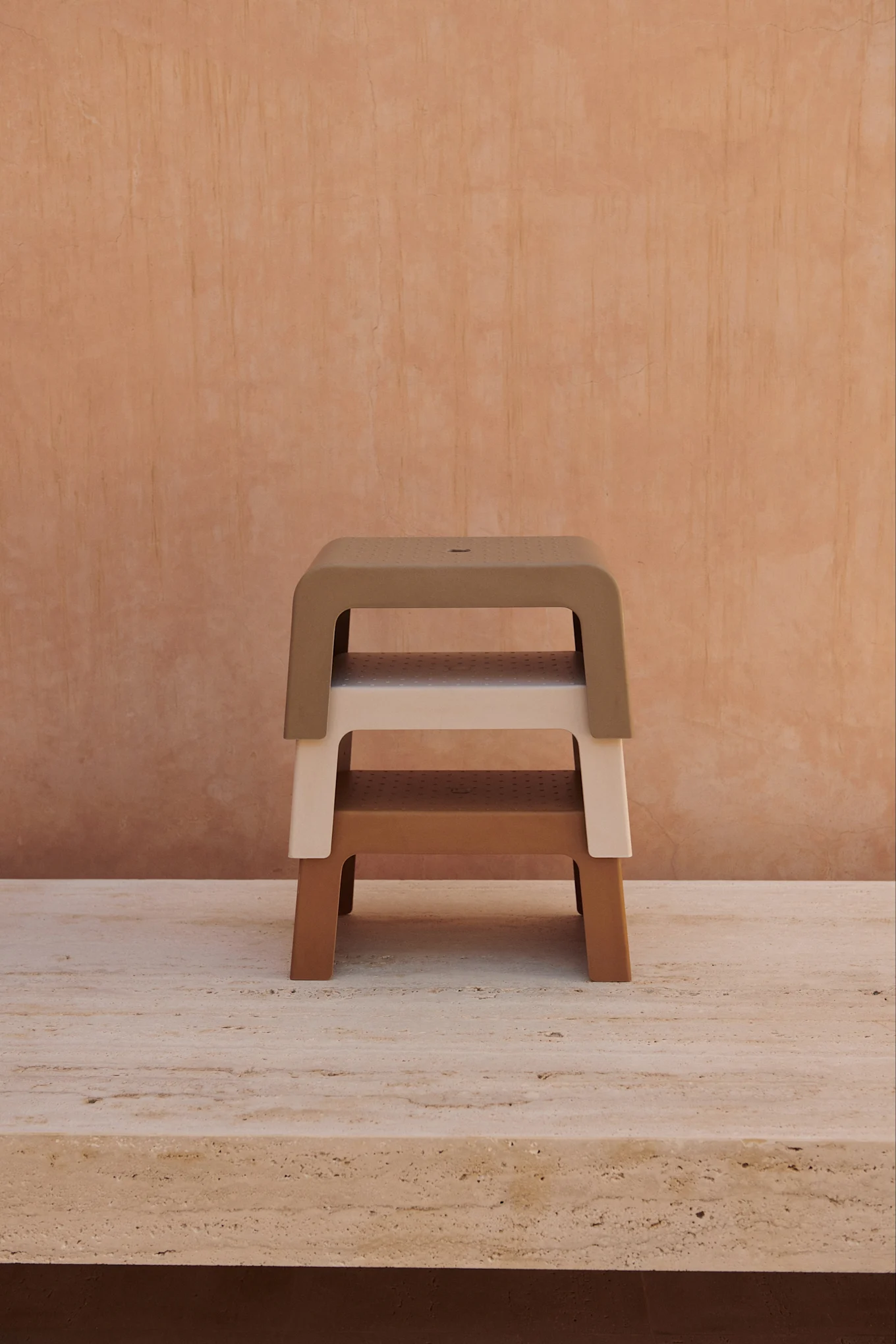 Three stools stacked on top of each other in clay tones that reflect the interior colour trends for 2026.