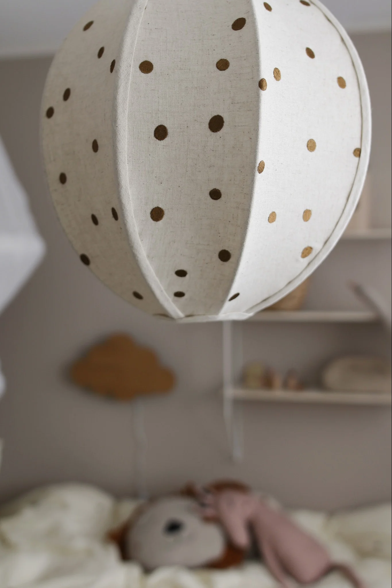 The dots ceiling lamp from ferm LIVING is the perfect accessory for a children's room with its playful design language.