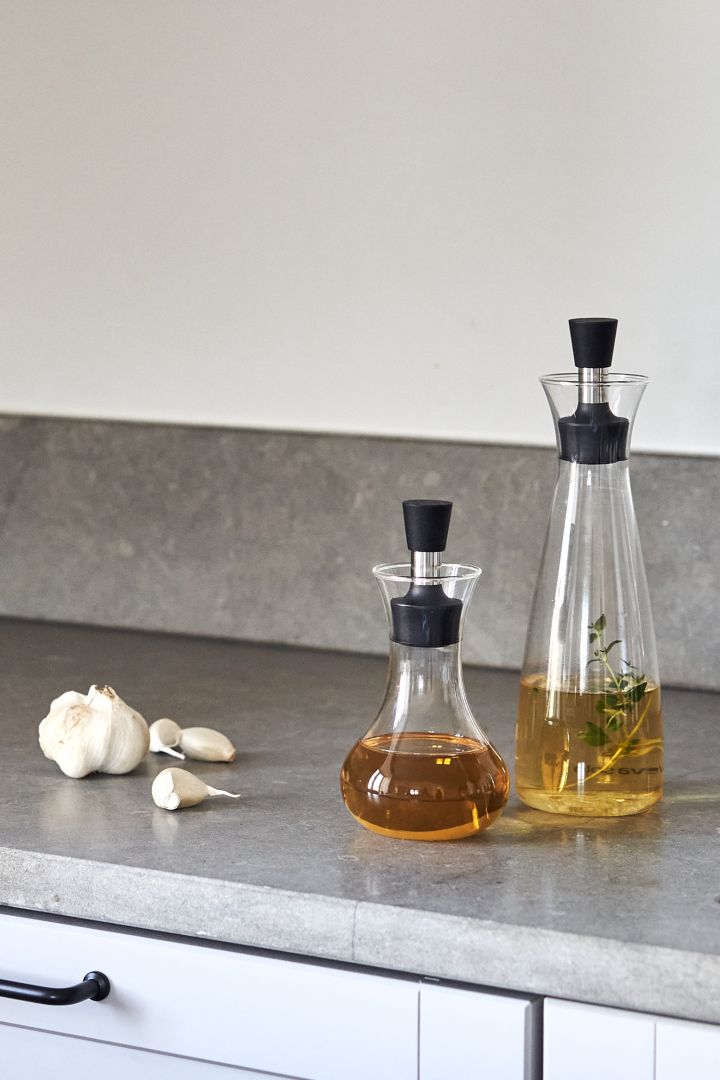 Renew your kitchen with 11 practical and stylish kitchen accessories for easier cooking - here you see the stylish Eva Solo oil and vinegar carafe and dressing shaker in glass.