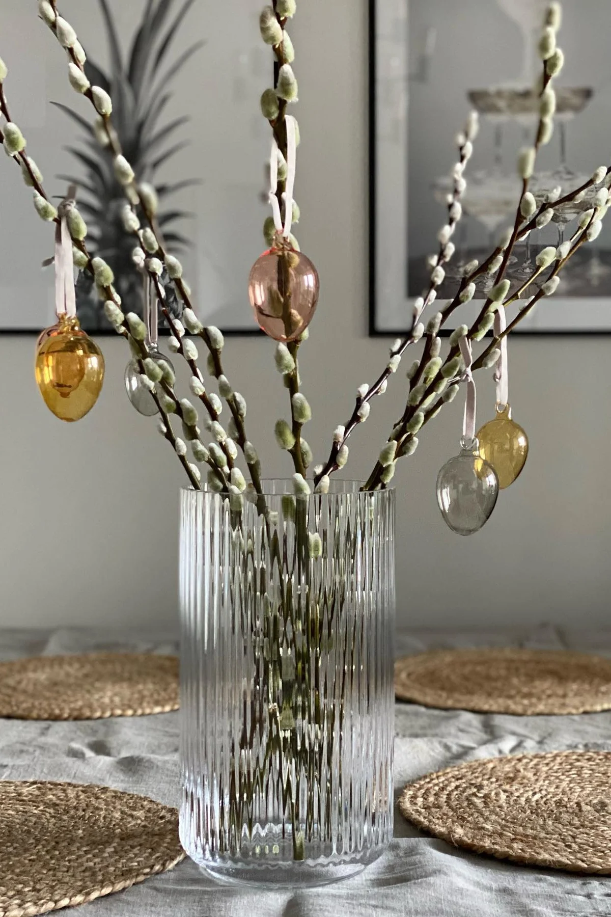 Easter decoration: The Iittala glass eggs hang from an Easter bush in a Lyngby glass vase from Lyngby Porcelæn in @marinaslgh's home.
