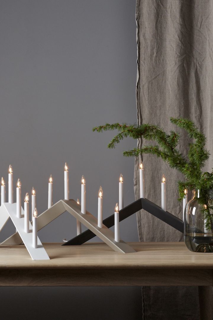 Stylish Christmas candle bridges to light up your windowsill this Christmas. Here you see the Arrow candle arch from Star Trading in three different colours. 