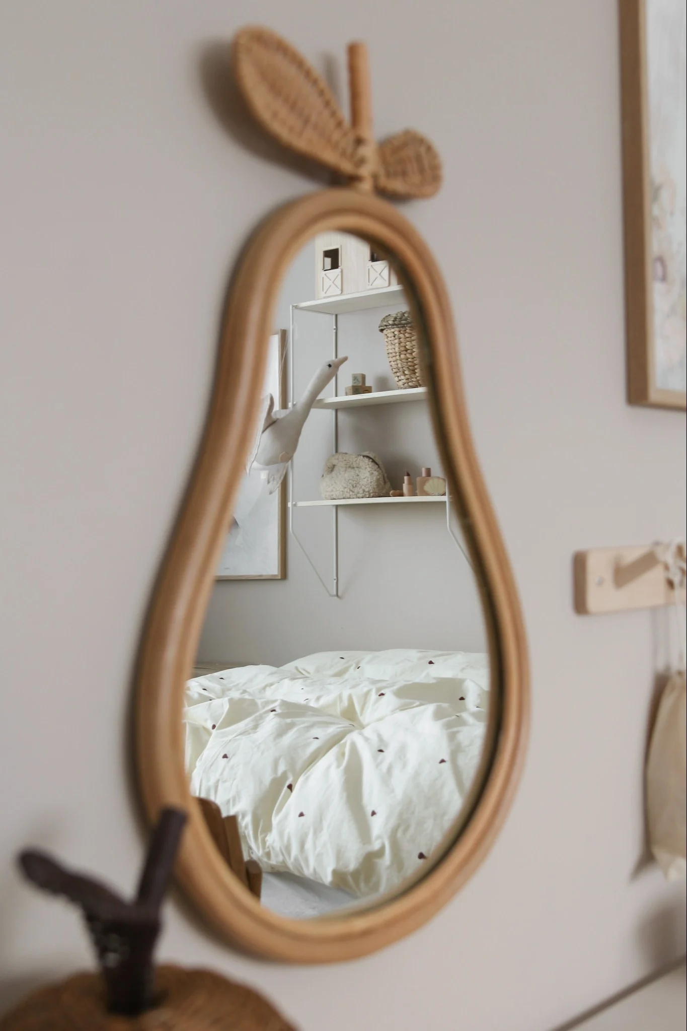 Decorate your children's bedroom with adorable and playful accessories like this pear shaped mirror from ferm LIVING.