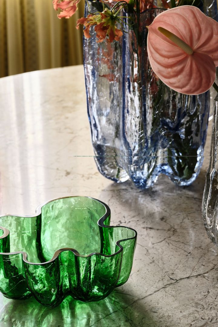 Kosta Boda glass bowls from the Crackle series in cracked glass, in green, pink and clear glass.