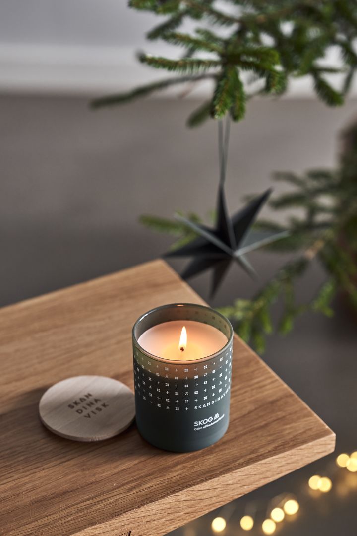 Scented candle from Skandinavisk with the forest scent is one of the most stylish Scandi Christmas decorations for 2022.